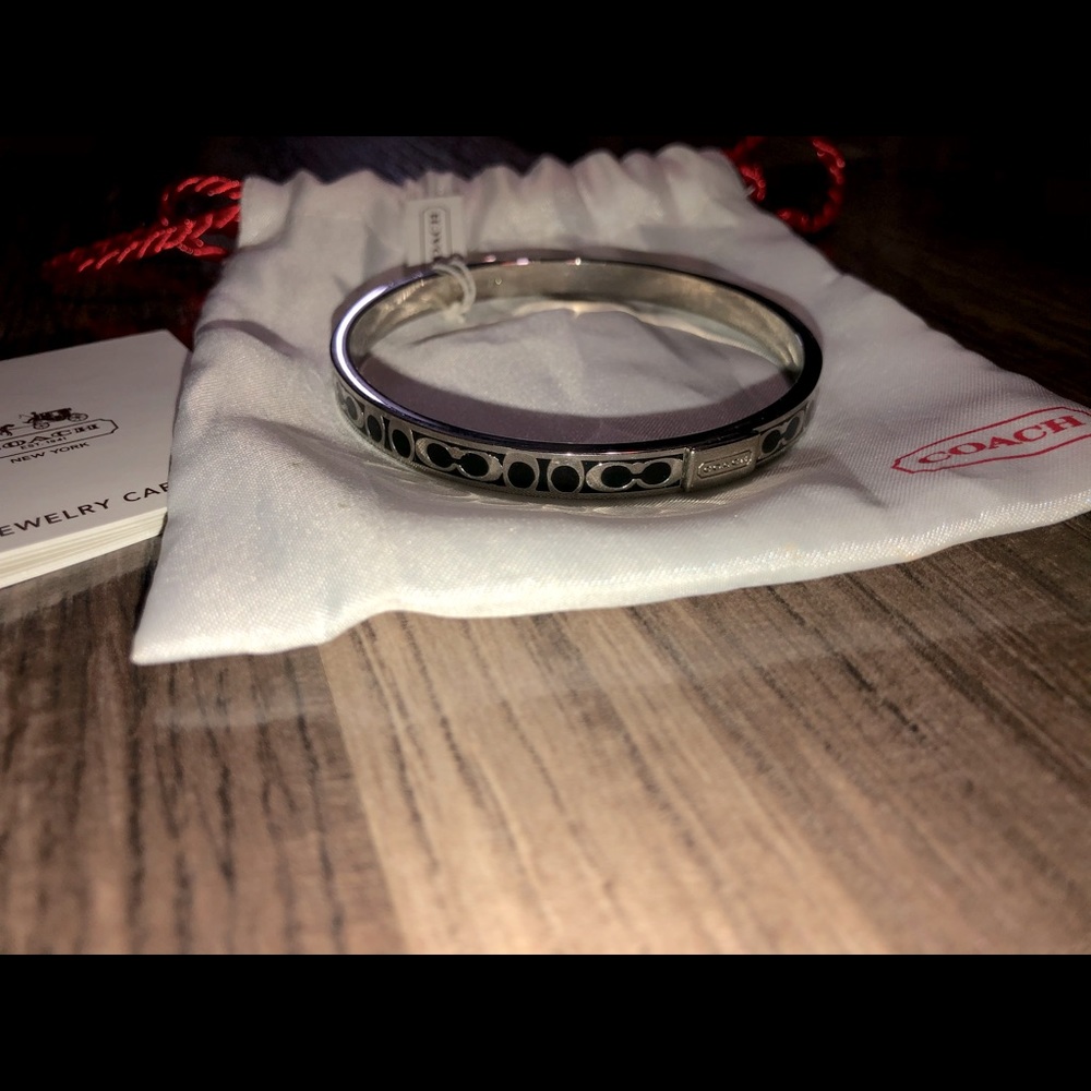 Coach bangle bracelet. Black and silver. With tag, bag, and care pamphlet